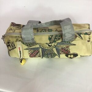 Harajuko Lovers by Gwen Stefani mini shoulder bag with a Crush whistle charm.